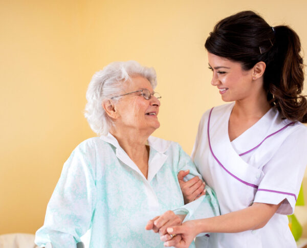 Two,Women,Teamwork,,Lady,Doctor,Holding,Senior,Woman,Resident,By